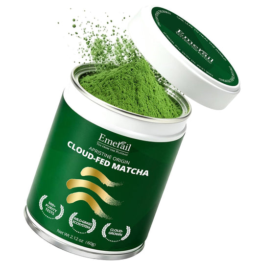 Emerail cloud-fed matcha tin with open lid and mounded powder in green